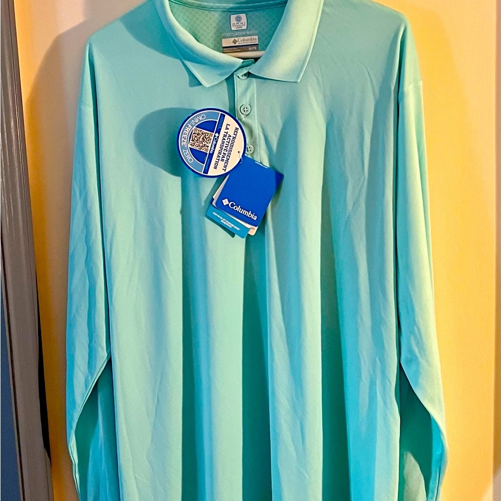 Columbia men’s long sleeve polo in light blue. Size XL; New with tags, mega air.